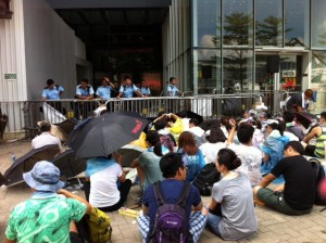 Some sit quietly in front of the police